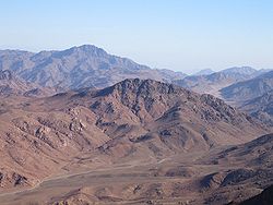 An image of beautiful, huge, mountains with the clear blue sky in the background.