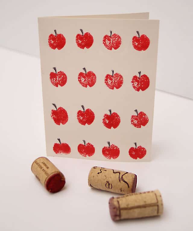 Crafts and games including corkscrews and a card with images of apples on it.