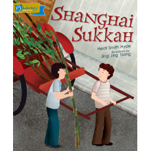 The cover of the book Shanghai Sukkah by Heidi Smith Hyde and Jing Jing Tsong. Two people pull a red cart filled with green branches.