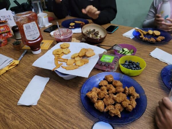 A photo of foods on a table including yucca latkes.