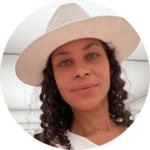 Headshot of Sarah Kolker in a white cowboy hat