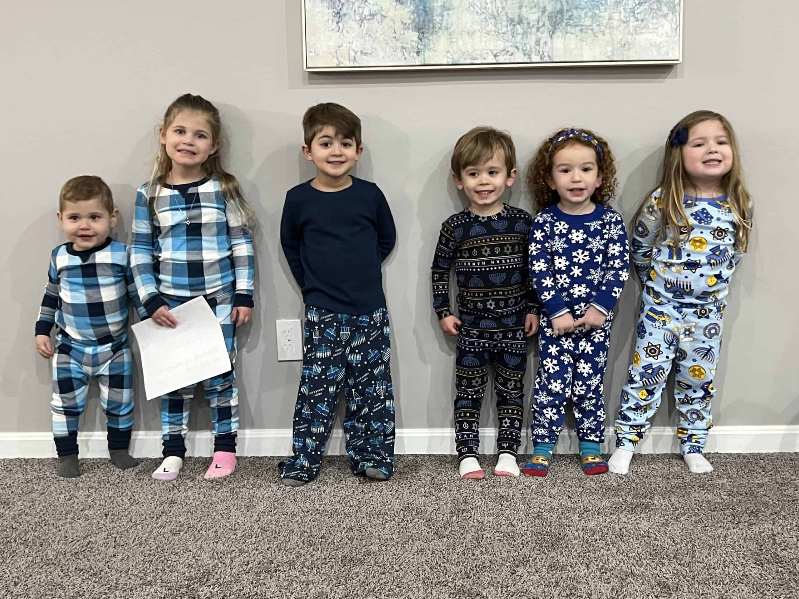 A photo of six toddlers and small children, standing against a wall, and holding a sign that says thank you jkidphilly we had so much fun at our get together. You can probably guess that their adults had a difficult time getting them to stand still for the picture.